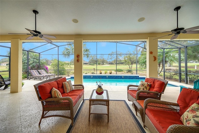 view of patio with outdoor lounge area and glass enclosure