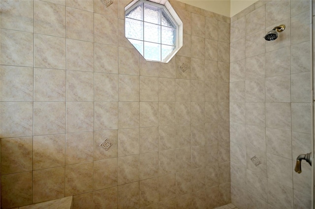 bathroom with a tile shower