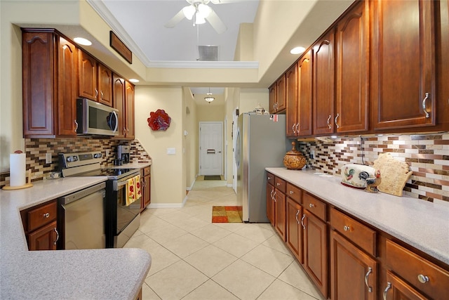 kitchen featuring ceiling fan, light tile patterned floors, backsplash, and appliances with stainless steel finishes