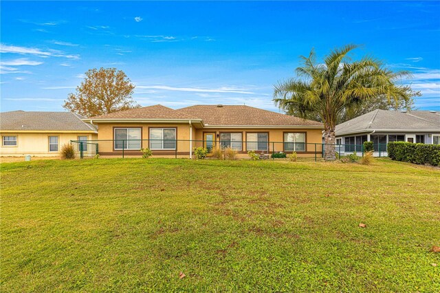 ranch-style house with a front yard