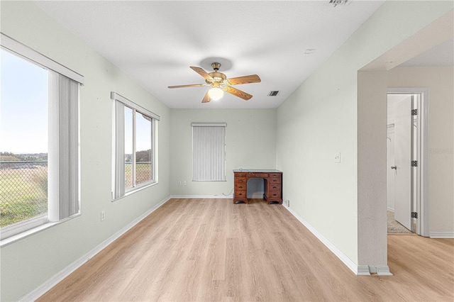 unfurnished living room featuring light hardwood / wood-style flooring and ceiling fan