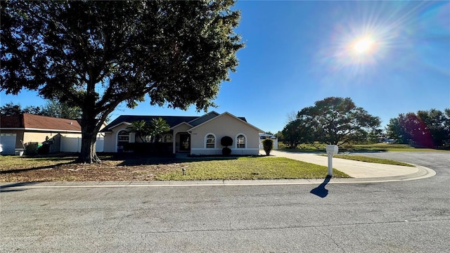 single story home with a front yard