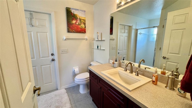 bathroom featuring an enclosed shower, vanity, a textured ceiling, tile patterned flooring, and toilet