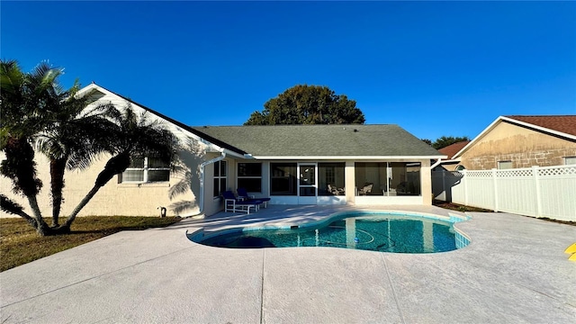 view of pool featuring a patio and a sunroom