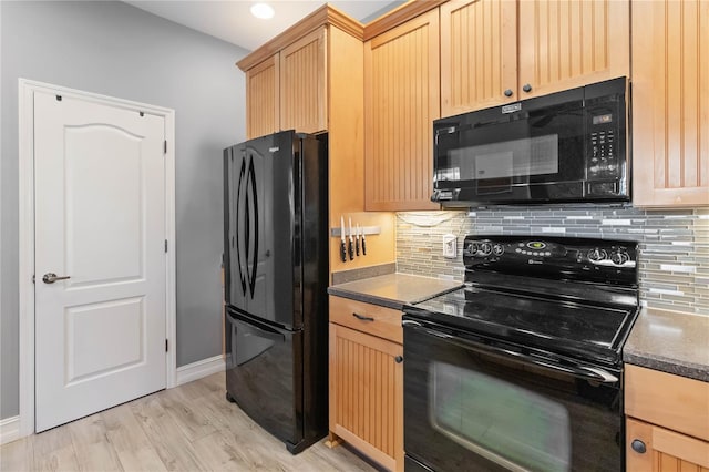 kitchen featuring decorative backsplash, light brown cabinets, black appliances, and light wood-type flooring