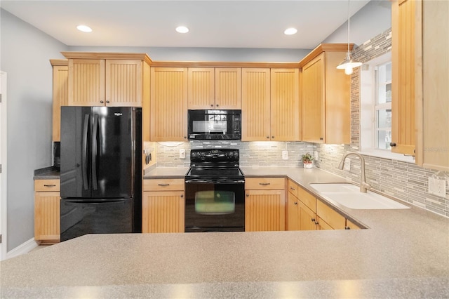 kitchen featuring light brown cabinetry, sink, backsplash, and black appliances