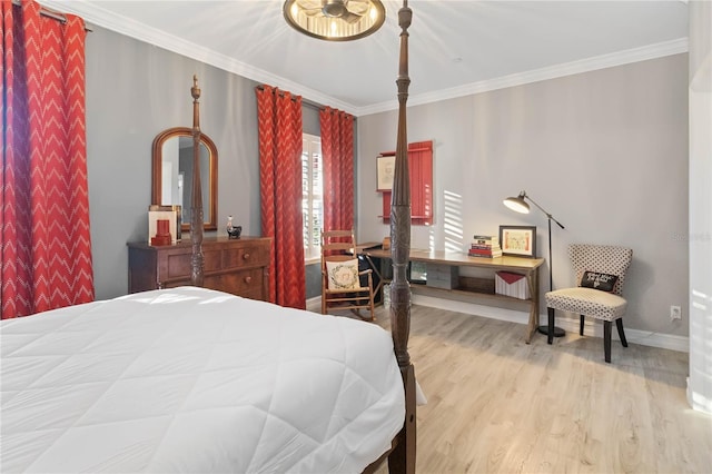 bedroom with light hardwood / wood-style floors and crown molding