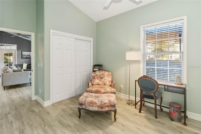 sitting room featuring light hardwood / wood-style flooring and lofted ceiling