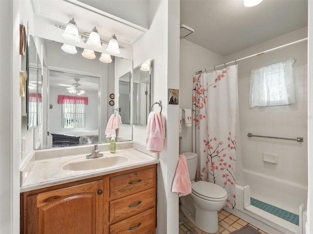 full bathroom featuring ceiling fan, shower / tub combo with curtain, vanity, and toilet