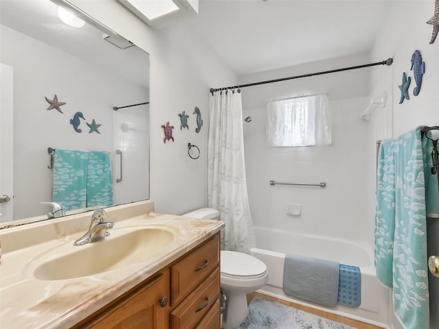 full bathroom with vanity, toilet, and shower / tub combo