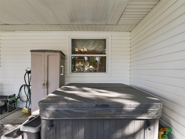 wooden deck with a hot tub