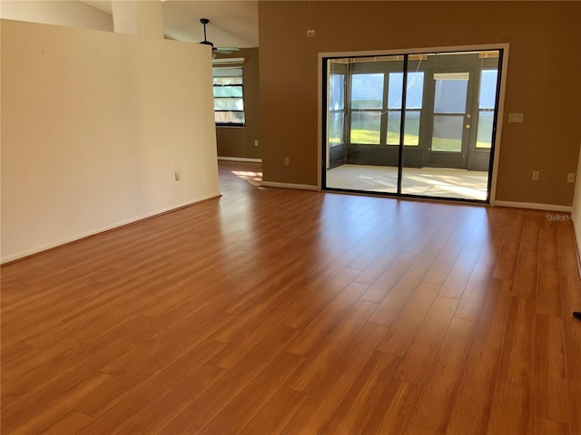 unfurnished room with ceiling fan and light hardwood / wood-style flooring