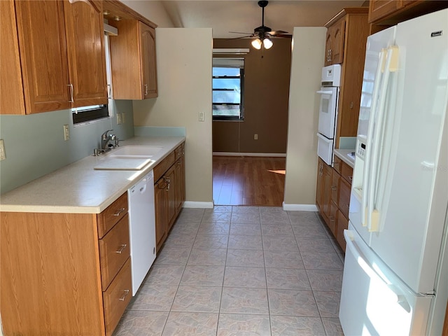 kitchen with ceiling fan, sink, light tile patterned floors, and white appliances