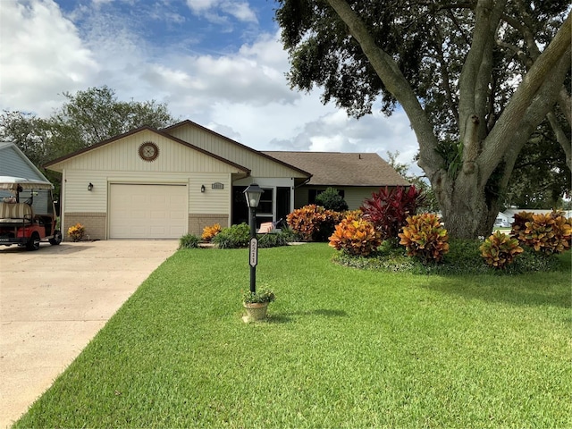 ranch-style house with a garage and a front yard