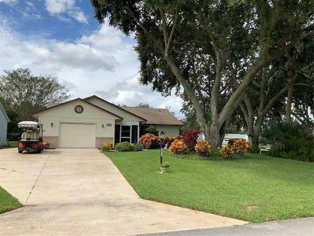 single story home with a garage and a front lawn