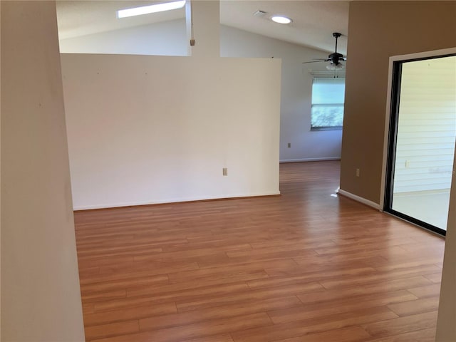 unfurnished room with light hardwood / wood-style flooring, ceiling fan, and lofted ceiling