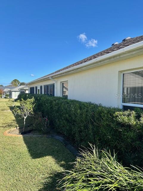 view of home's exterior with a lawn