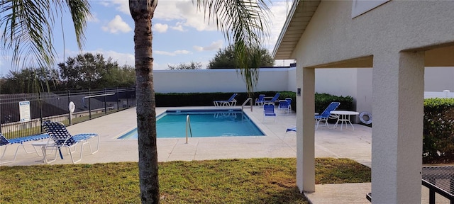 pool featuring a patio area and fence