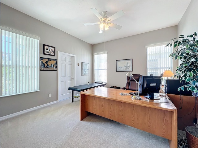 office space with light carpet and ceiling fan