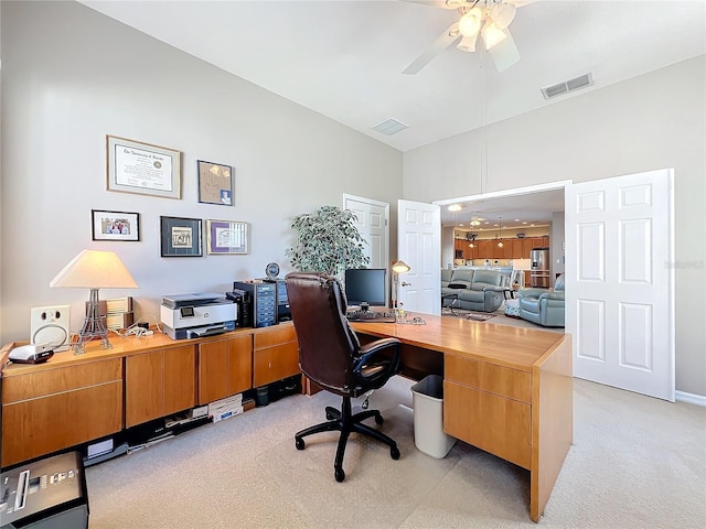 office area featuring ceiling fan and light carpet