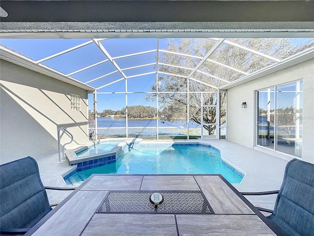 view of swimming pool featuring glass enclosure, a patio area, a water view, and an in ground hot tub