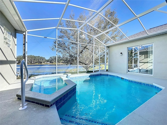 view of pool featuring an in ground hot tub and a lanai