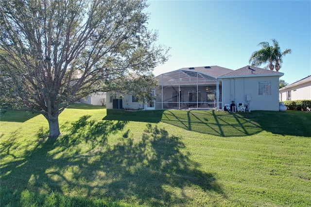 view of yard featuring glass enclosure