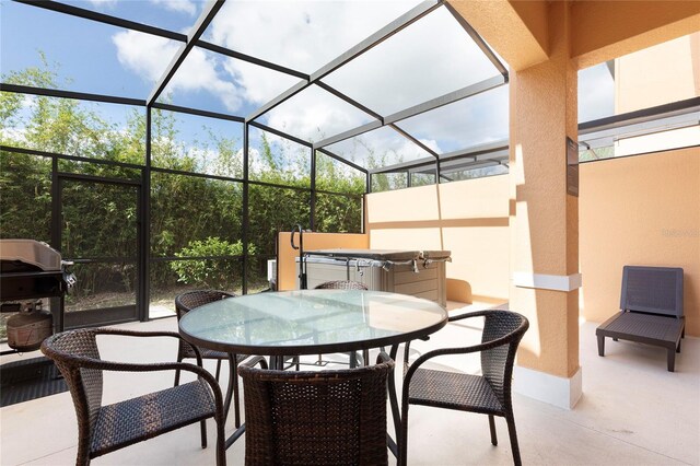 view of patio / terrace featuring area for grilling and a lanai