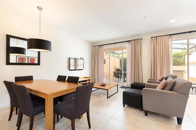 dining room with a wealth of natural light and light tile patterned flooring