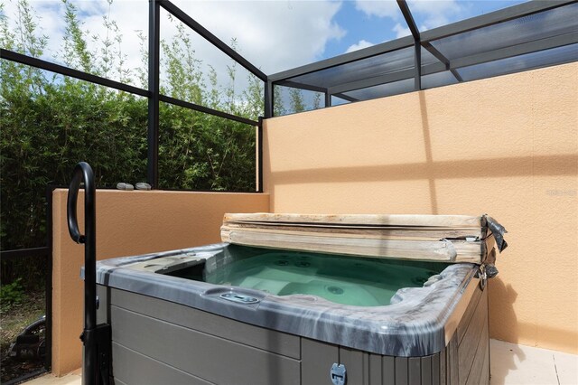 view of patio / terrace with a hot tub