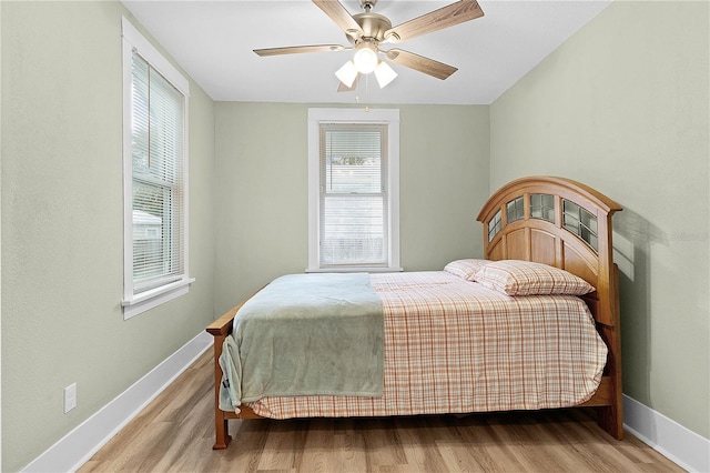 bedroom featuring light wood-type flooring and ceiling fan