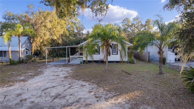 view of front of home with a carport