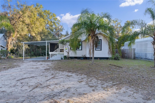 view of front of home with a carport