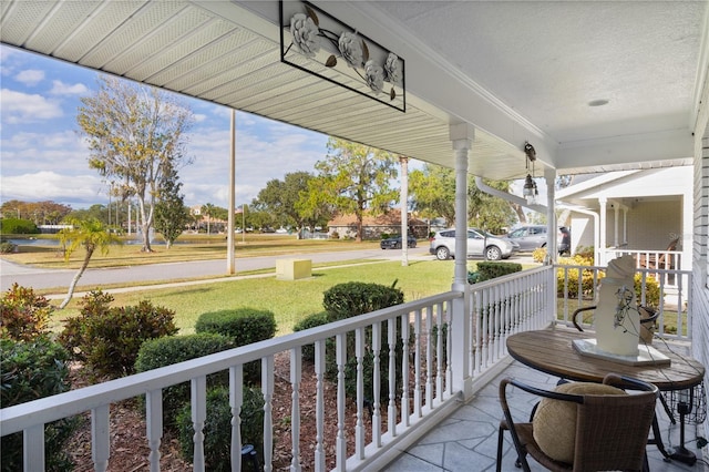 balcony featuring a porch