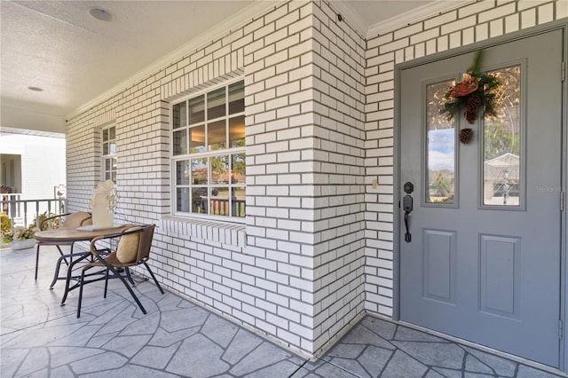 doorway to property with covered porch