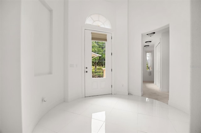 entryway featuring light tile patterned flooring