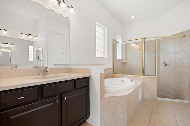 bathroom featuring a wealth of natural light, tile patterned flooring, vanity, and shower with separate bathtub