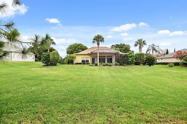 view of yard with a lanai