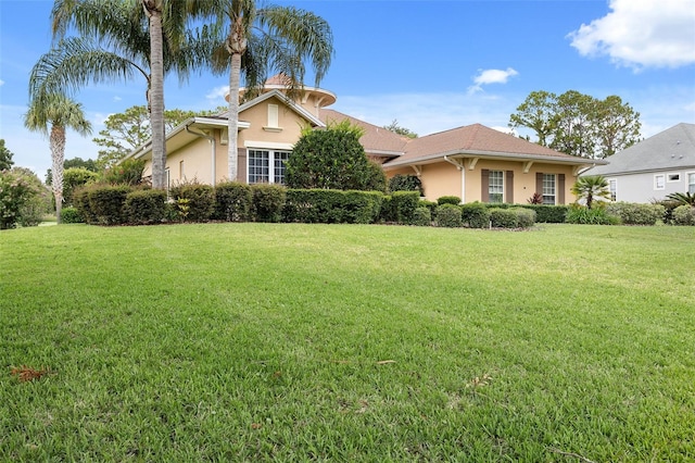 view of front of property with a front lawn