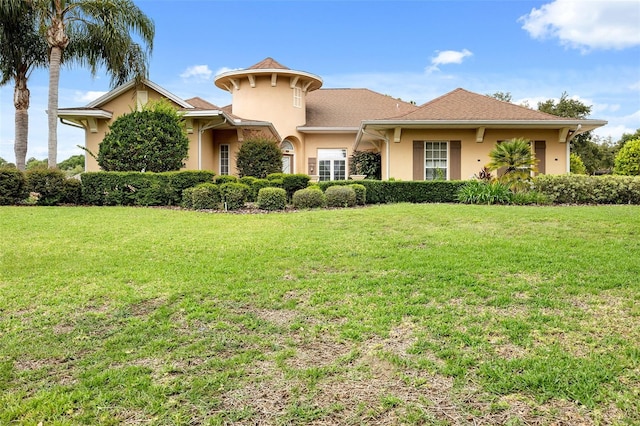 view of front of property with a front lawn