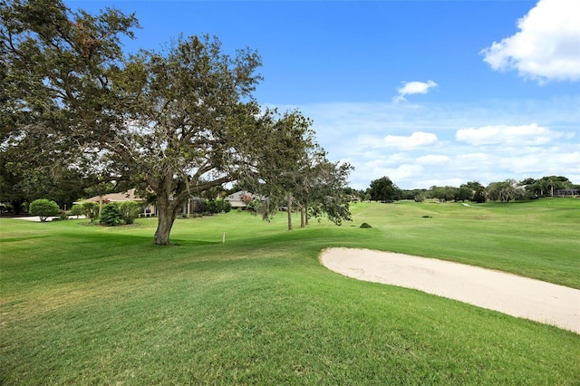 view of property's community with a lawn