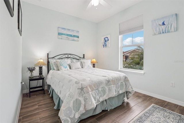 bedroom featuring ceiling fan and dark hardwood / wood-style floors