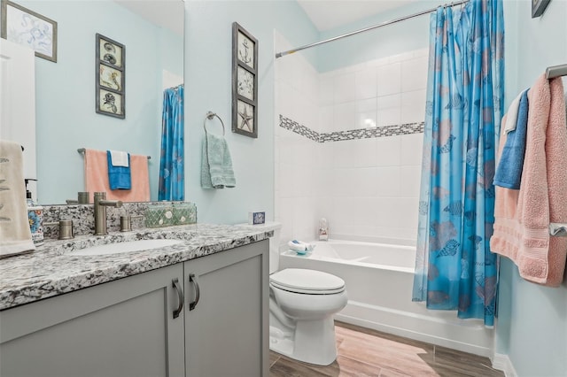 full bathroom with vanity, toilet, and shower / bath combo with shower curtain