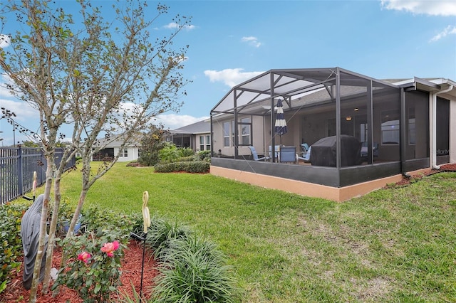 view of yard with glass enclosure