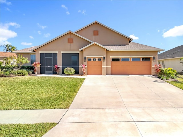 view of front of house with a front lawn and a garage