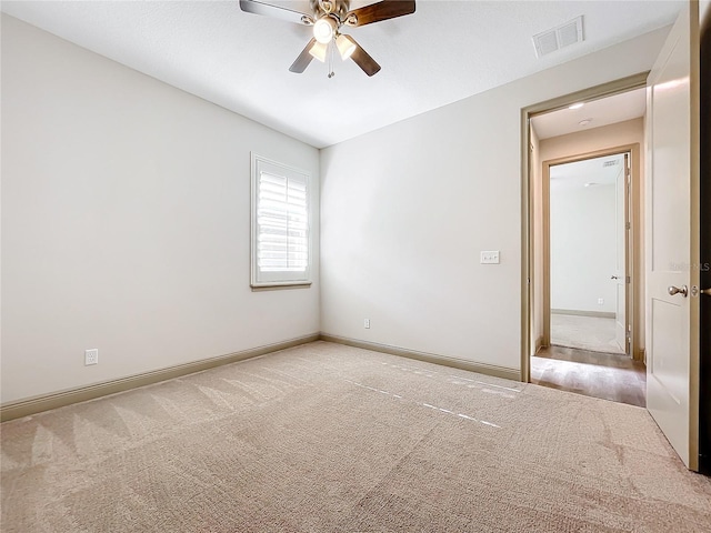 unfurnished room featuring carpet flooring and ceiling fan