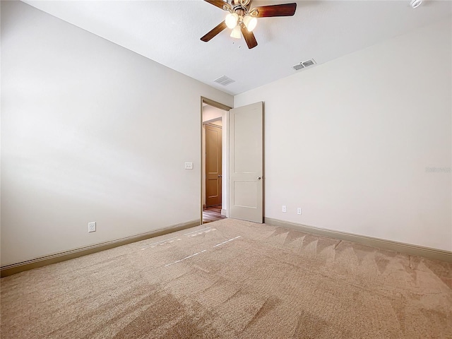 carpeted empty room with ceiling fan