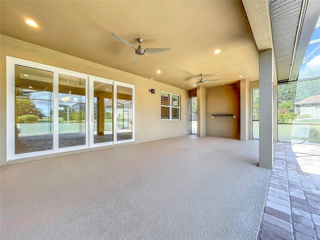 view of patio featuring ceiling fan