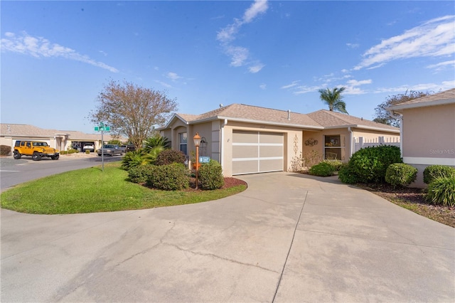 ranch-style house with a garage and a front lawn