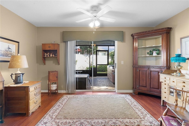 doorway to outside with dark hardwood / wood-style flooring and ceiling fan